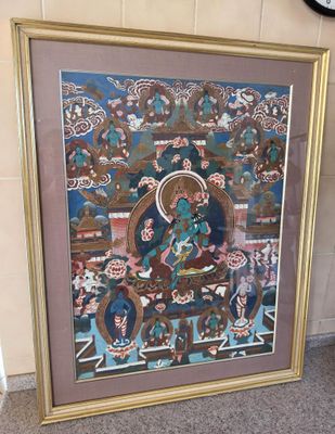 tableau représentant un Bouddha, dans un cadre doré