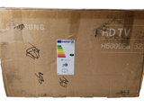 une boîte en carton sur laquelle est collé un autocollant portant l'inscription « Samsung »