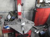 a red machine that is sitting in a garage