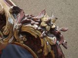 a close up of a mirror with a decorative design