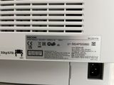 a white air conditioner sitting on a table