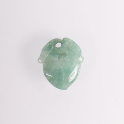 green jade leaf pendant on a white background