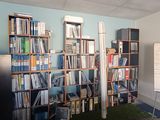 a room with a lot of books on the shelves