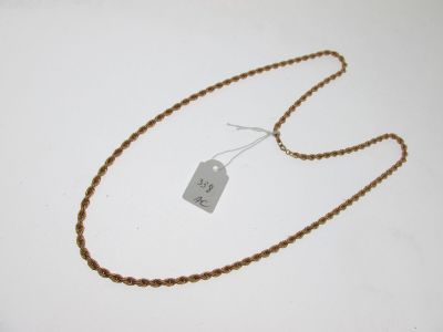 an image of a necklace with a tag on it on a white surface