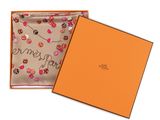 a box with a scarf inside of it on a white background