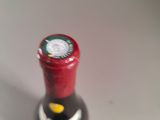 a bottle of wine that is sitting on a table