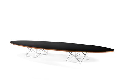 an oval table with a metal base and a black top