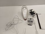 a white table topped with electronic items on it