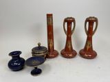 several different types of vases are sitting on a white surface