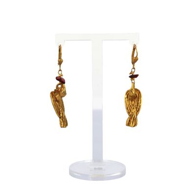 an image of a pair of gold earrings with a bird on it