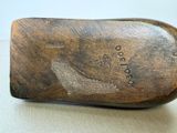a close up of a wooden shoe on a table