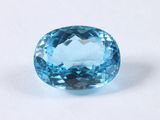 a blue topazte gems on a white surface