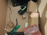 a box with a television and other items inside of it