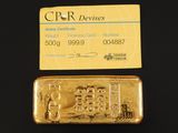 un lingot d'or et une carte de visite posés l'un à côté de l'autre