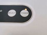 a close up of a button on the side of a machine
