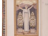 someone is holding an open book with a picture of a woman in a white dress