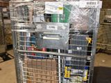 a metal cart with many items in it in a warehouse