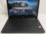 the laptop is open on a white surface with a beach in the background