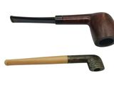 a pipe and a pipe holder sitting next to each other