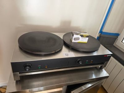 an image of a stove top with two pans on it