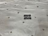 a white shirt with a black and white logo on it