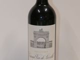 a bottle of wine that is sitting on a table