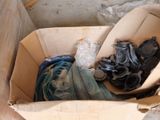 a cardboard box with a bunch of items inside of it