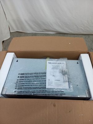 a cardboard box with a package in it sitting on the floor