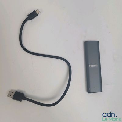 a usb cable connected to an external device on a table