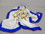 an image of a white and blue scarf laying on top of a table