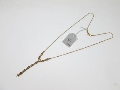 a gold necklace with a chain and a tag on it