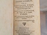 an old book with writing on it sitting on a table