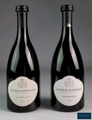 two bottles of wine sitting next to each other on top of a table