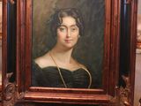 painting of a woman in a black dress sitting on a chair