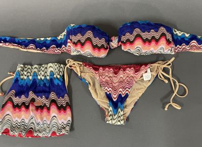 an image of a bikini and panties are shown on a gray surface