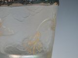 a glass with a handle and a handle on it