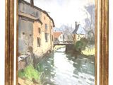une image représentant un tableau où l'on voit une rivière avec des bâtiments en arrière-plan