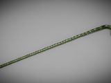 a close up of a green cane on a white surface