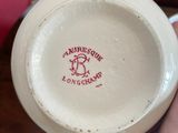a person holding a cup that has a logo on it