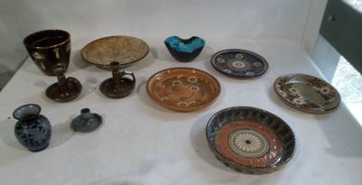 many different types of bowls and cups on the table