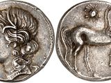 a silver coin with an image of a woman and a horse on it