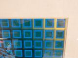 a picture of a blue and yellow painting on a wall