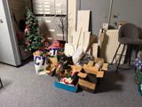 a room with a lot of boxes and a christmas tree in it