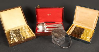 three silverplated spoons and two silverplated spoons in a case
