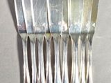 a lot of spoons that are sitting on a table