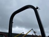 a crane that is standing in the back of a truck