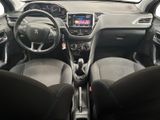 the interior of a small car with a steering wheel and dashboard