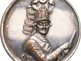 an image of a silver medal with a man holding a knife