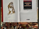 an open book with a drawing of a woman on it