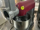 a red mixer that is sitting on a table